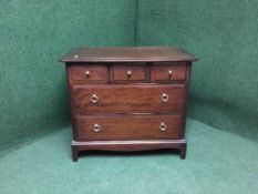 A mahogany stag five drawer chest
