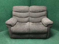 A four piece electric reclining suite upholstered in a brown fabric