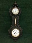 A Victorian cast iron barometer clock