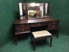 A mahogany stag kneehole dressing table with stool