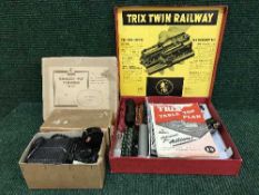 A boxed Trix twin railway set with manuals and a box of track and power supply