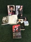 A collection of books relating to rock and pop including signed volumes by Ozzy Osbourne,