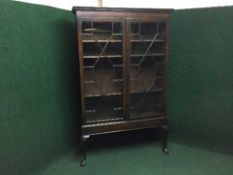 A Victorian style glazed door bookcase