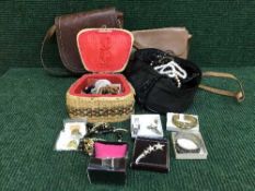 A basket of assorted costume jewellery - necklaces,