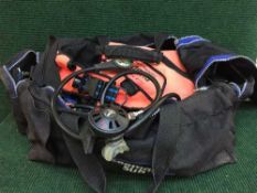 A holdall containing a large quantity of scuba diving equipment