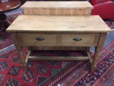 A Victorian style two drawer pine side table