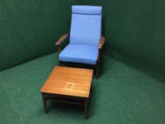 A pair of mid twentieth century teak armchairs together with a teak coffee table fitted with