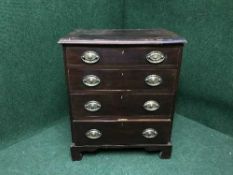 A Victorian inlaid mahogany four drawer chest