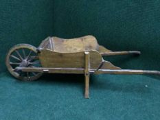 A mid twentieth century small pine wheel barrow