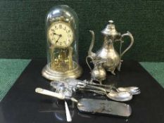 A small collection of plated wares together with an anniversary clock under dome