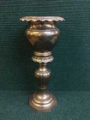 A heavy brass planter