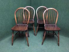 A set of four oak windsor style dining chairs