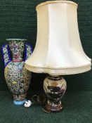 An Italian decorative twin handled vase and a table lamp with shade