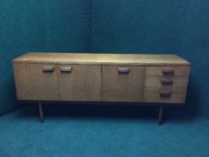 A mid twentieth century teak uniflex cocktail sideboard