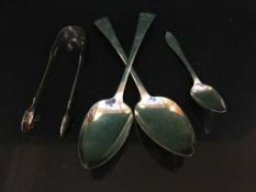 A pair of silver serving spoons,