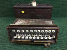 A 19th century mahogany cased accordion by W.