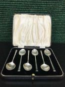 A set of six cased silver teaspoons