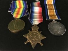 A trio of WWI medals with ribbons named to 5498 SJT. H. ASLETT. R.A.