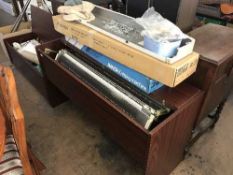 A knitting machine in cabinet and a cabinet of knitting accessories