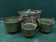 A set of six copper and brass graduated pans