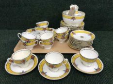 A tray of Minton fruit patterned tea china
