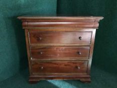 A four drawer mahogany chest