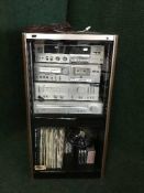 An Sansui hifi cabinet containing four piece JVC seperate system and a quantity of lps
