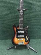 An electric guitar on stand