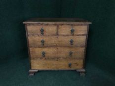 A Georgian oak four drawer chest