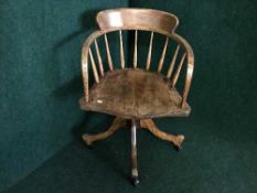 An elm wood swivel desk chair