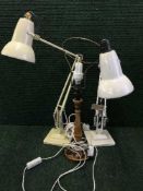 Two mid twentieth century angle lamps together with a wooden table lamp