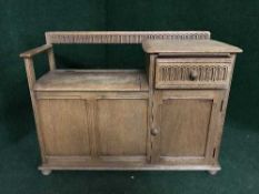 An Ercol storage telephone seat