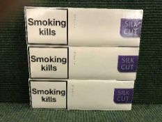 Three sealed 'brick' packs of 200 class A Silk Cut cigarettes.