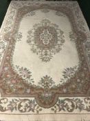 A Chinese woolen rug on green ground