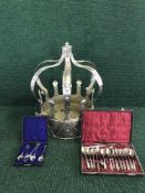 A metal Crown and two cases of plated cutlery