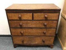 A Georgian oak and mahogany chest of five drawers