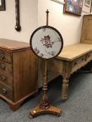 A Victorian mahogany pole screen