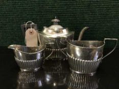 A three piece miniature silver tea service, 12.
