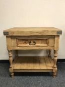 A reclaimed pine single drawer kitchen work table