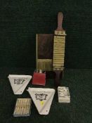 An early 20th century wooden and brass pill dispenser, two Panadol ceramic pill dispensers,