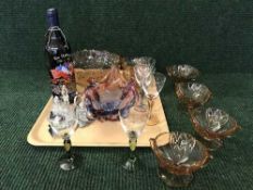 A tray of cruet set, coloured glasses, dessert bowl,