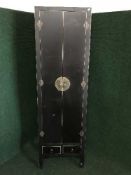 An Oriental style double door cabinet