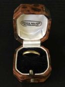 A 22ct gold band ring,