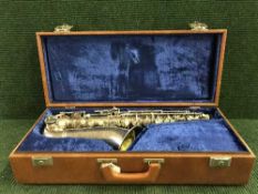 A Boosey and Hawkes early twentieth century saxophone, cased.