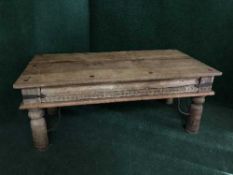 A pine coffee table with metal fittings