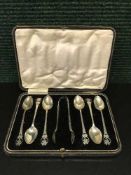 A set of six cased silver teaspoons with tongs,