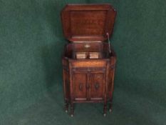 A carved oak gramophone cabinet