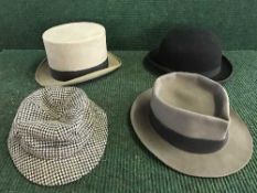 A basket of top hat, bowler hat,