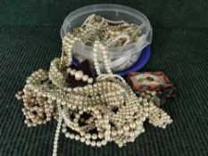 A box of simulated pearls, watch,