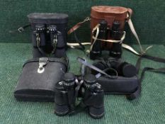 A basket of four pairs of binoculars including Ross of London, Miranda etc.